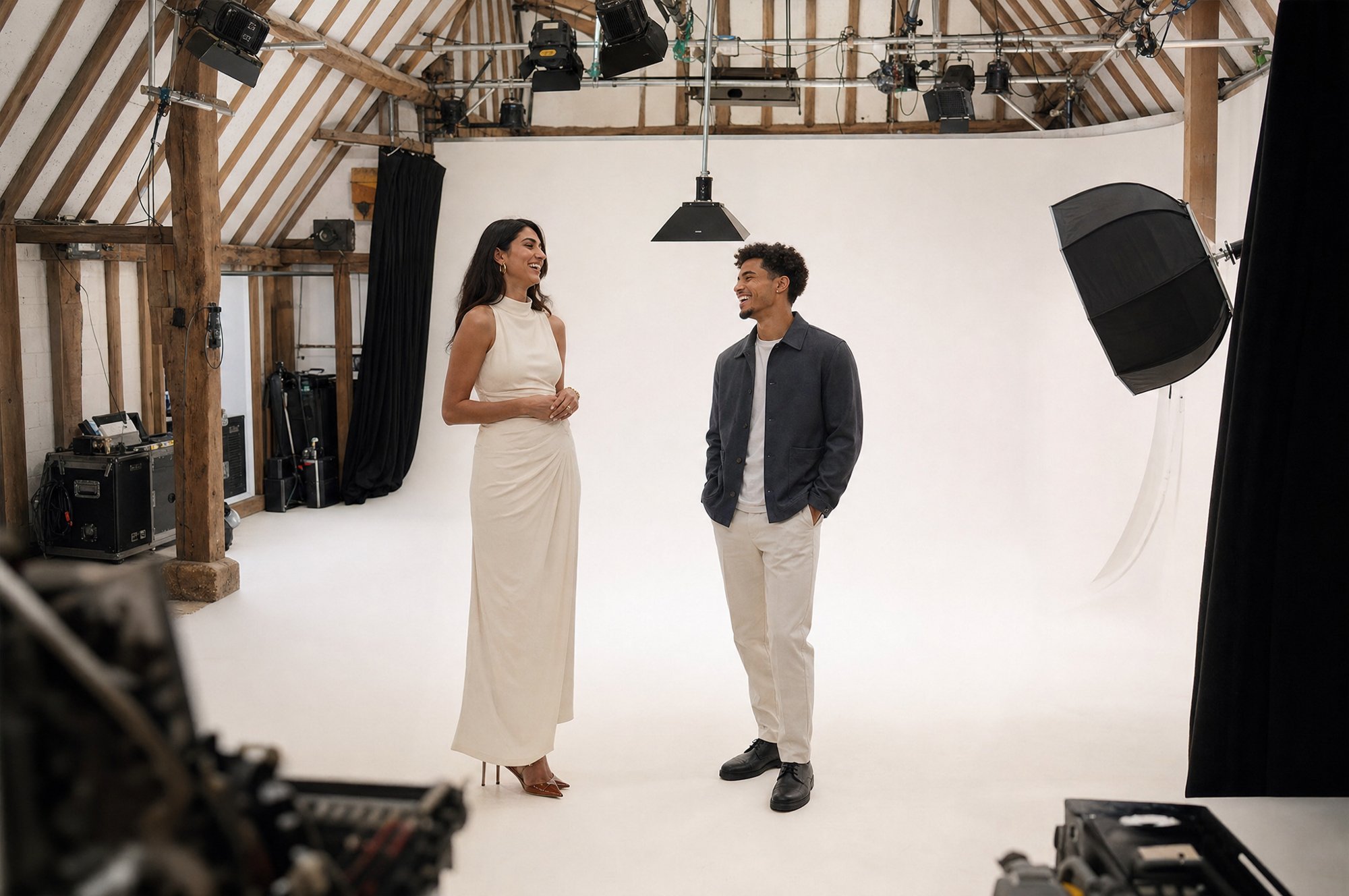 Two models on the white infinity cove between takes on a content shoot