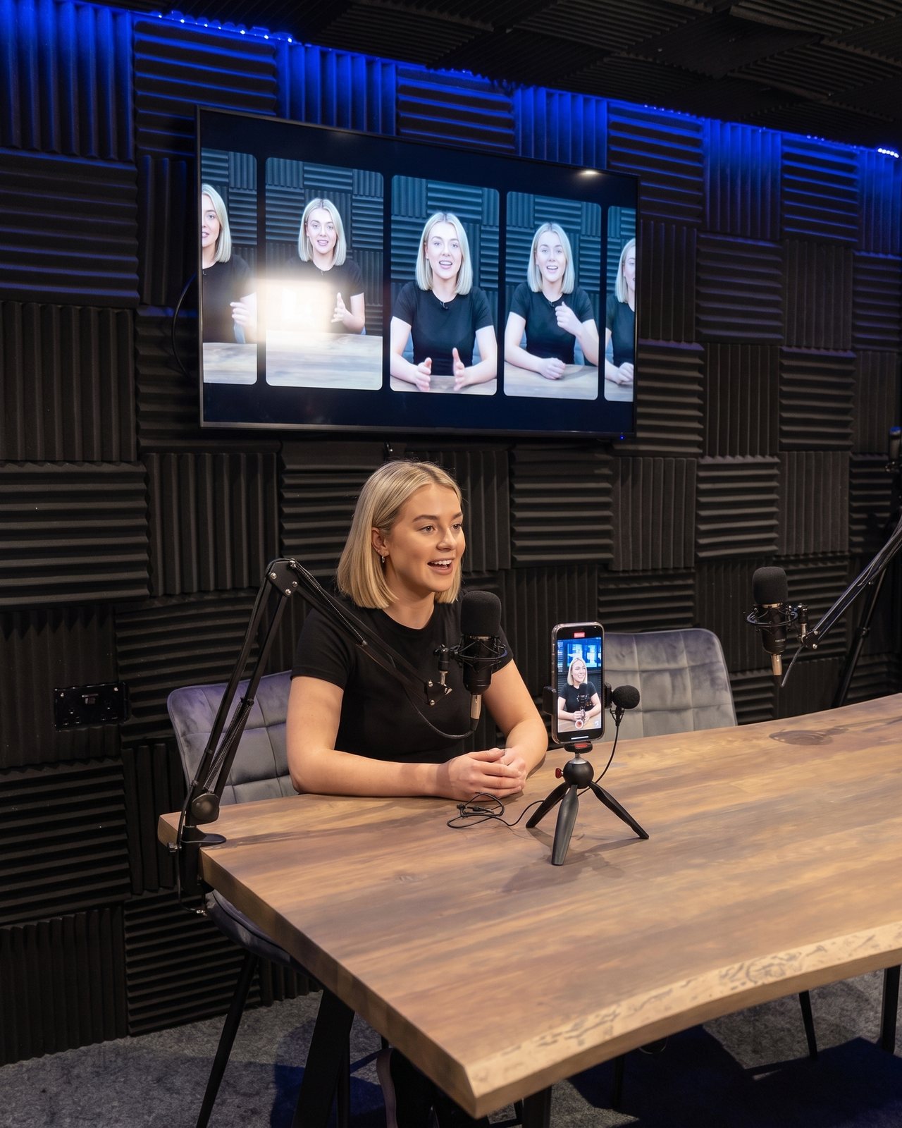 A creator recording short-form clips, a phone on a tripod and her edit on the screen