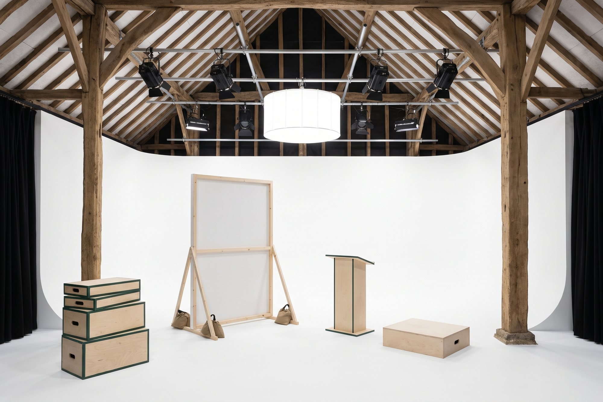 Apple boxes, a scenic flat, a lectern and a plinth set out on the cove