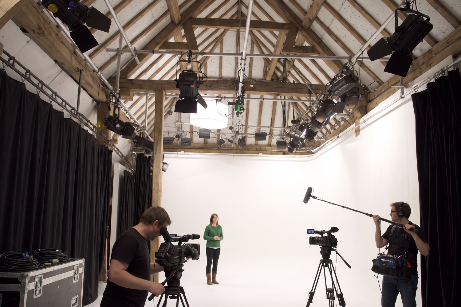A small crew filming a presenter on the White Space cove