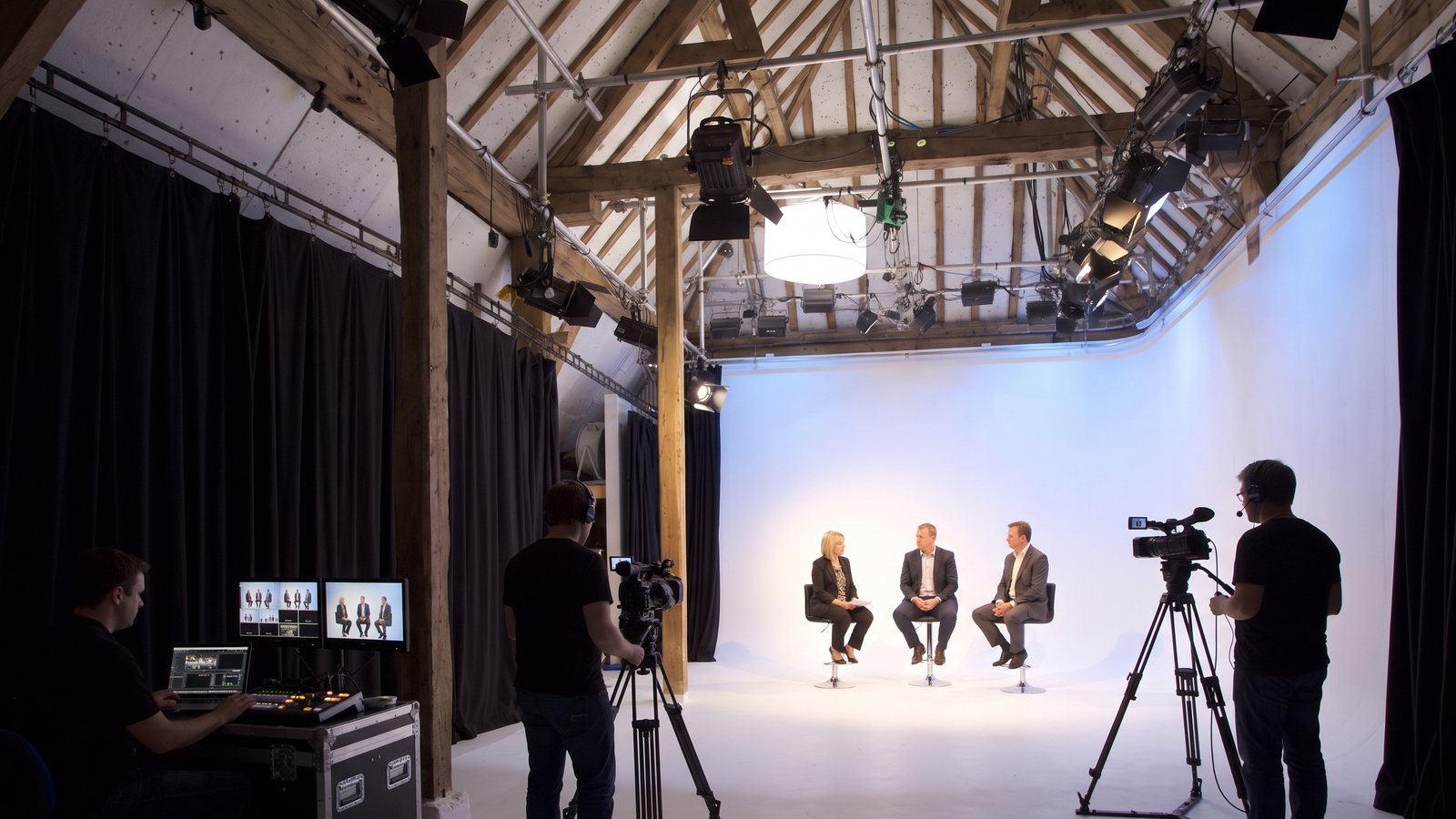 A live-streamed panel on the cove, vision mixing at the side of the stage
