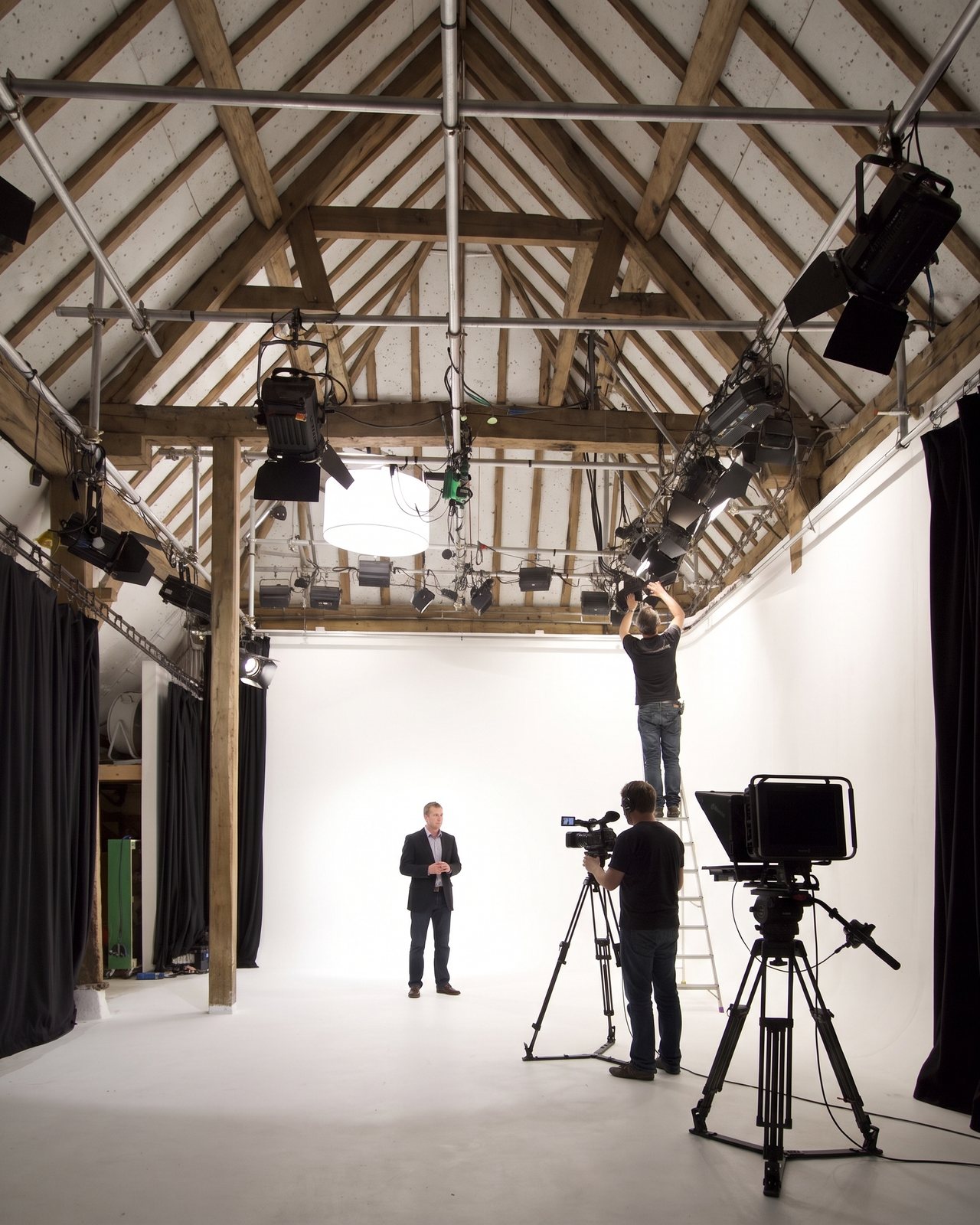 A presenter lit on the White Space cove, two cameras on tripods