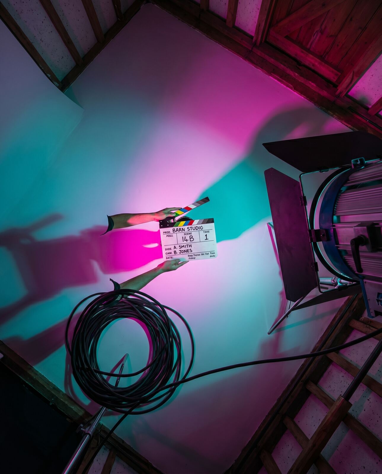 An overhead clapperboard shot under gels
