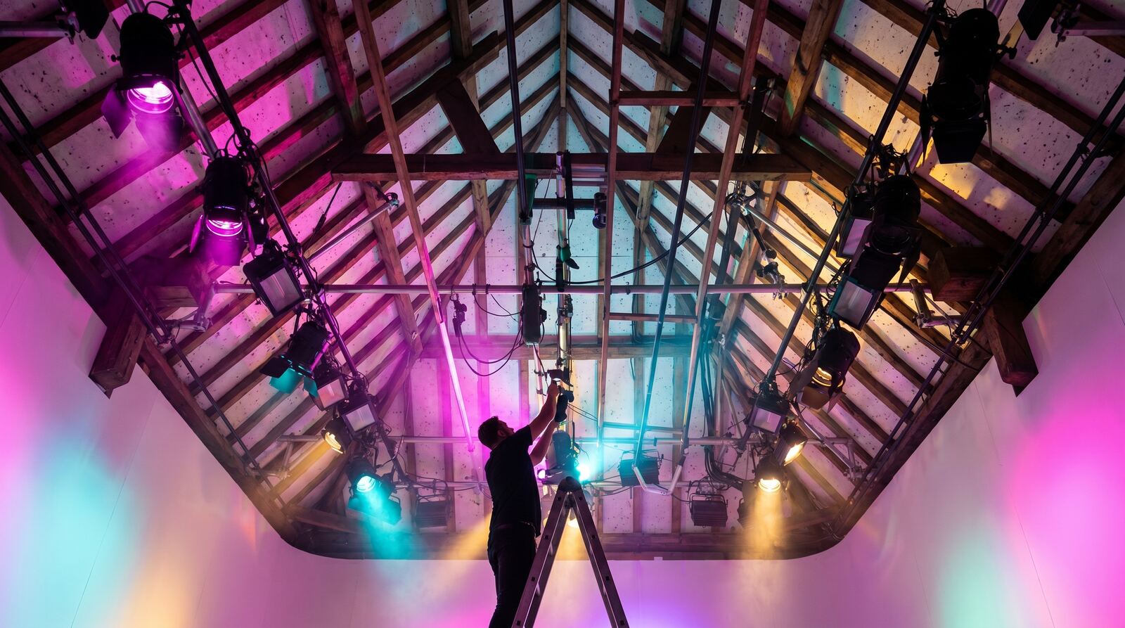 The barn rafters and lighting grid of the studio
