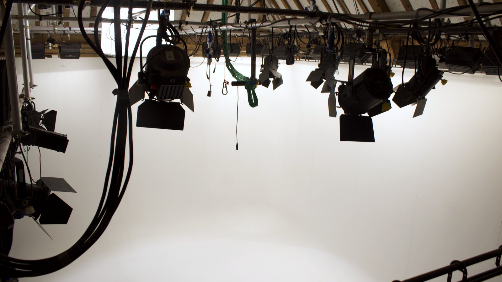 The studio lighting grid rigged into the barn trusses