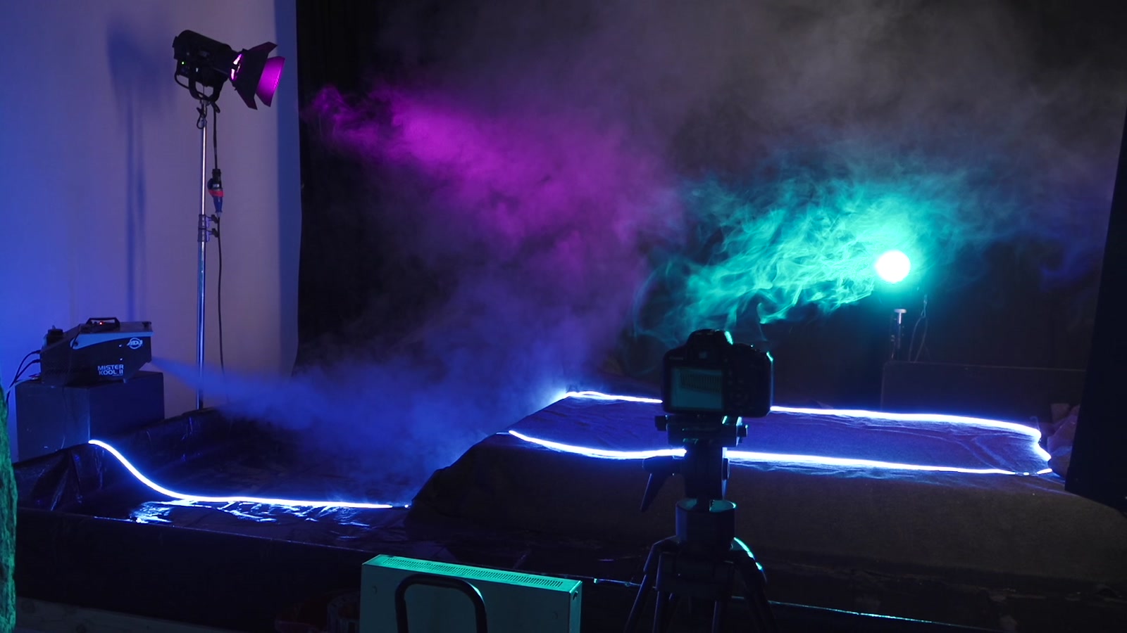 Gelled fresnels and haze on the studio floor with a camera on sticks