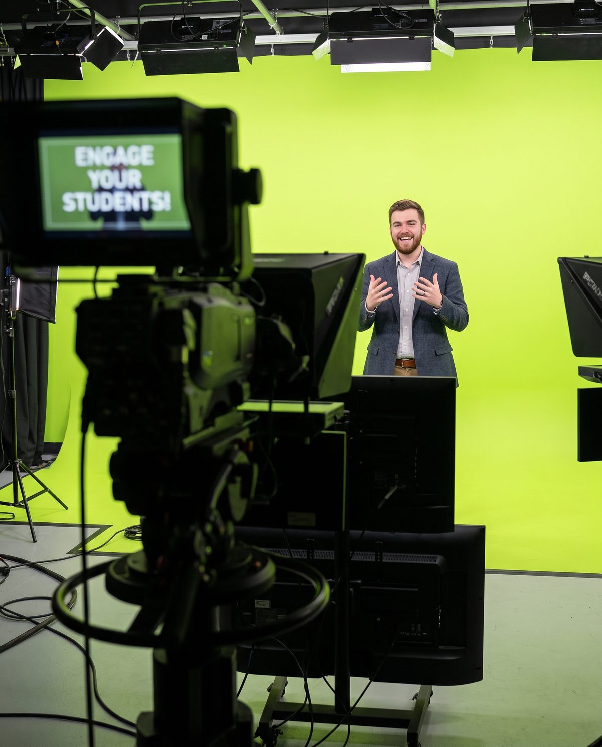 An over-the-shoulder view of a studio filming setup